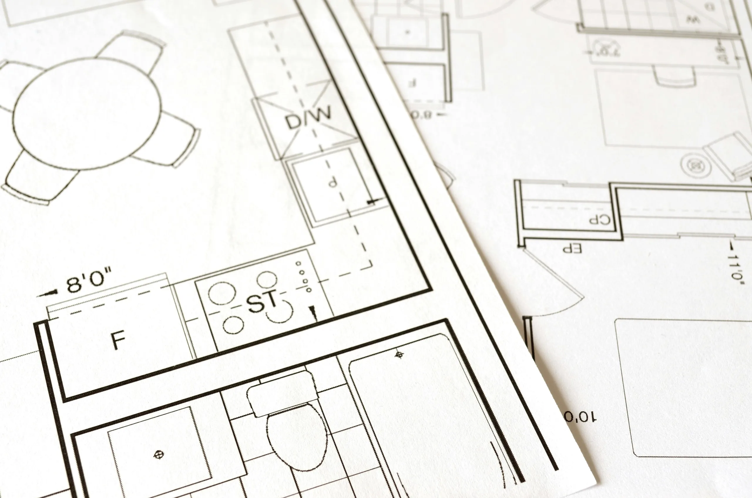 A couple of papers with floor plan layouts