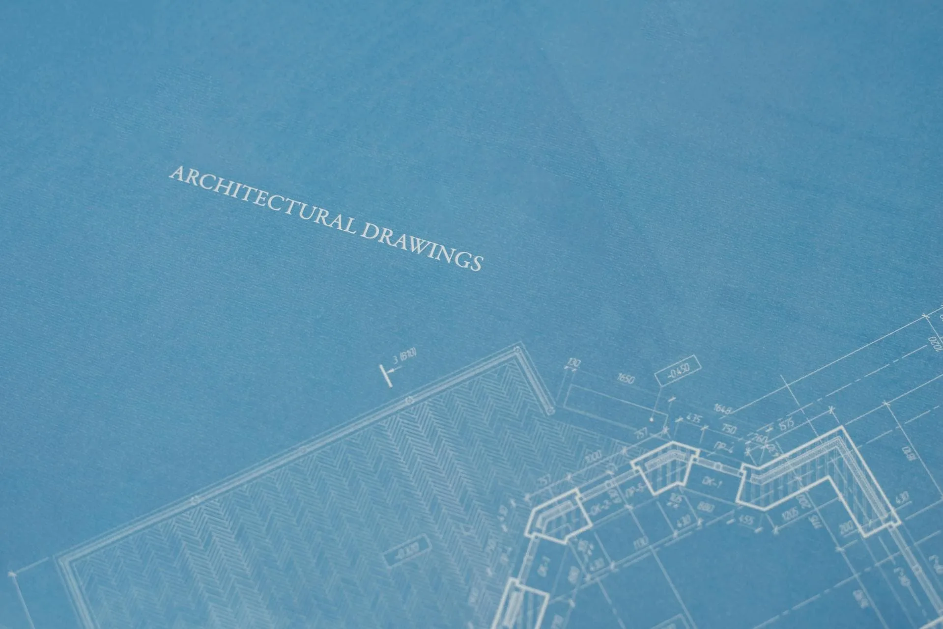 A blueprint paper with architectural drawings